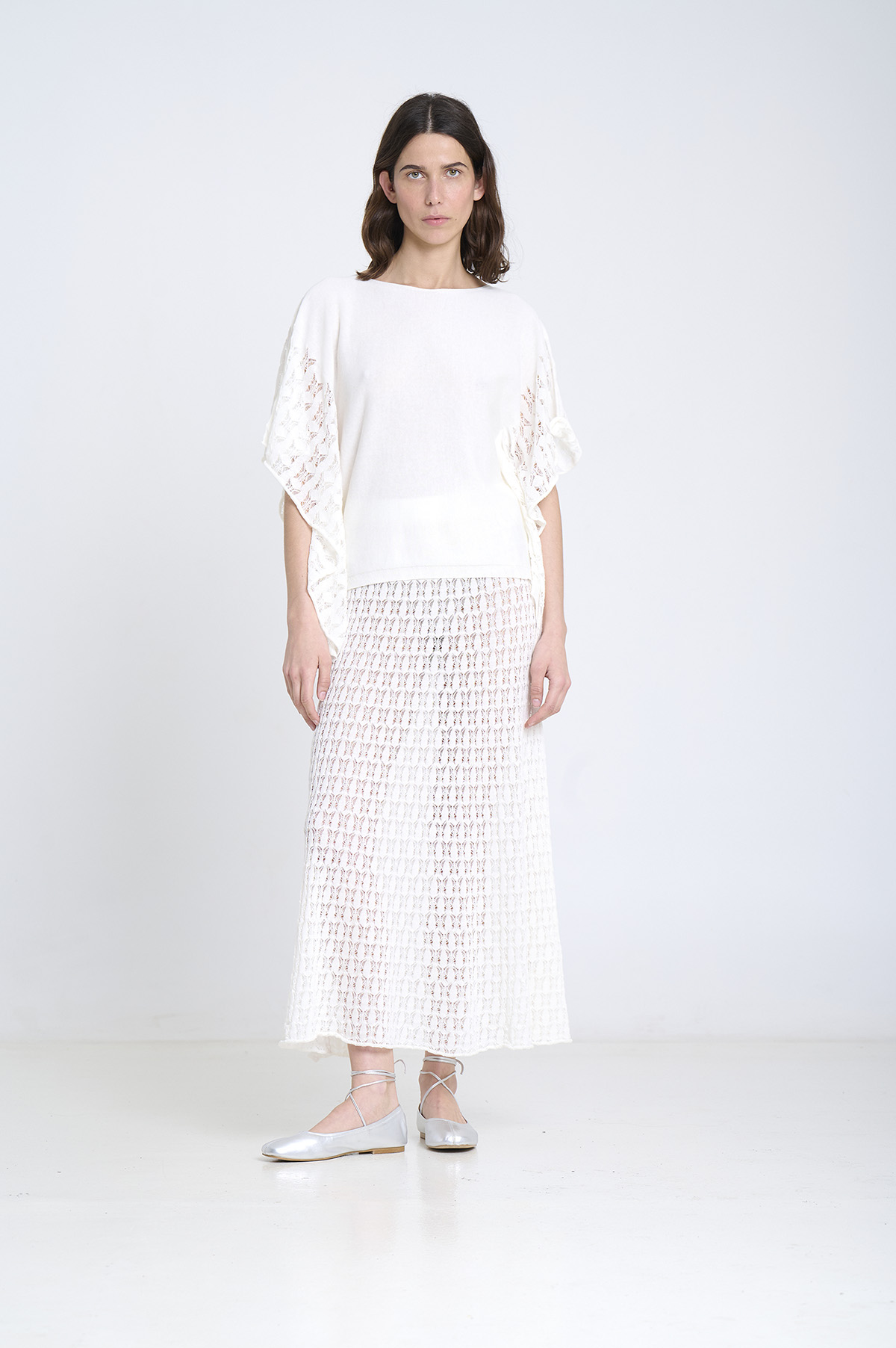 Capa de punto con laterales calados